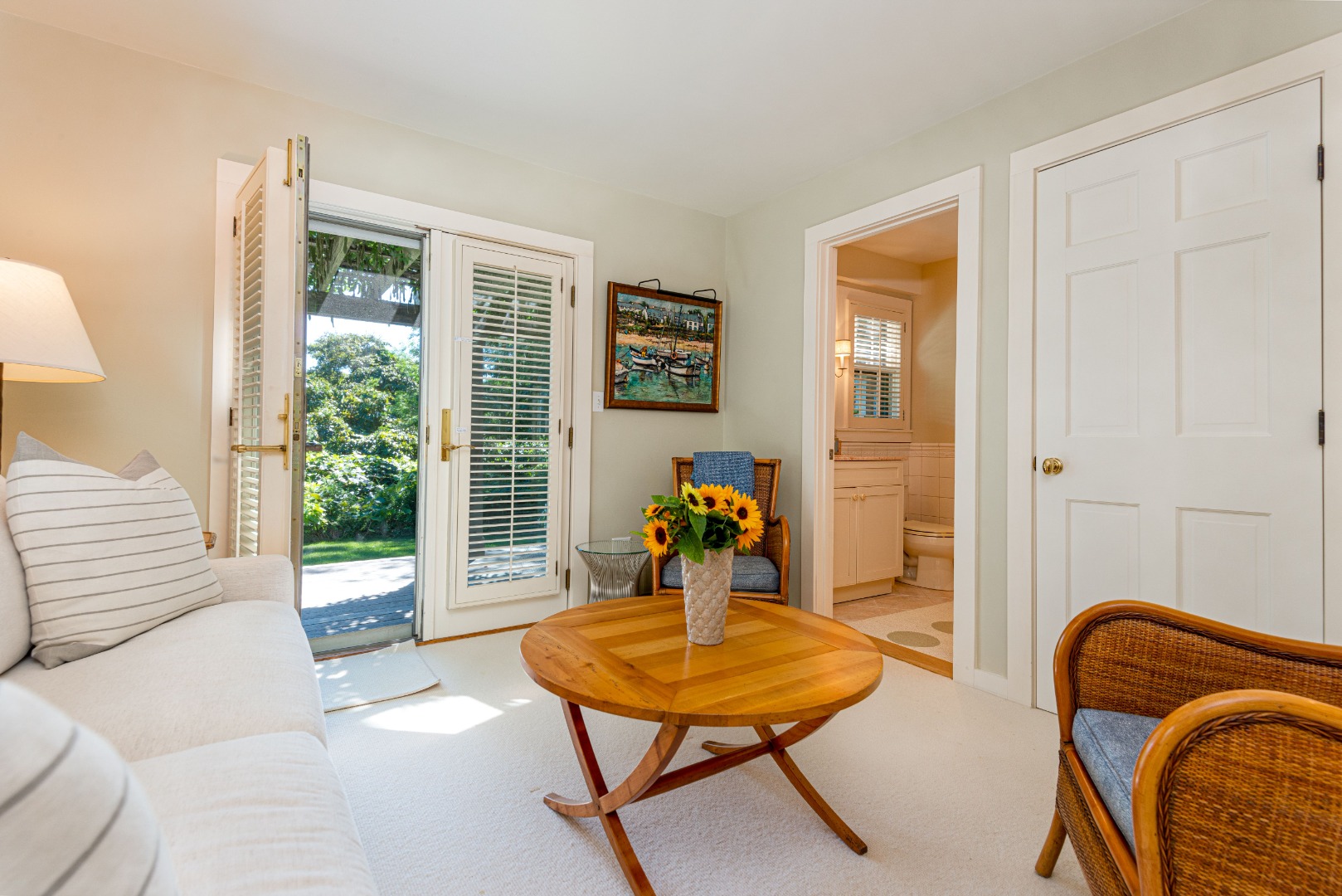 26 Pocomo Road Nantucket, MA 02554 - Photo 14 of 43 a living room with furniture and a potted plant