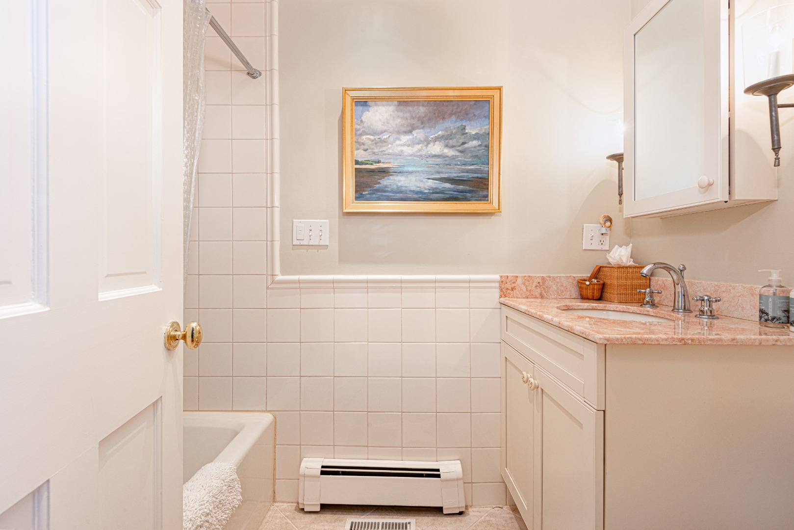 26 Pocomo Road Nantucket, MA 02554 - Photo 18 of 43 a bathroom with a sink and a mirror