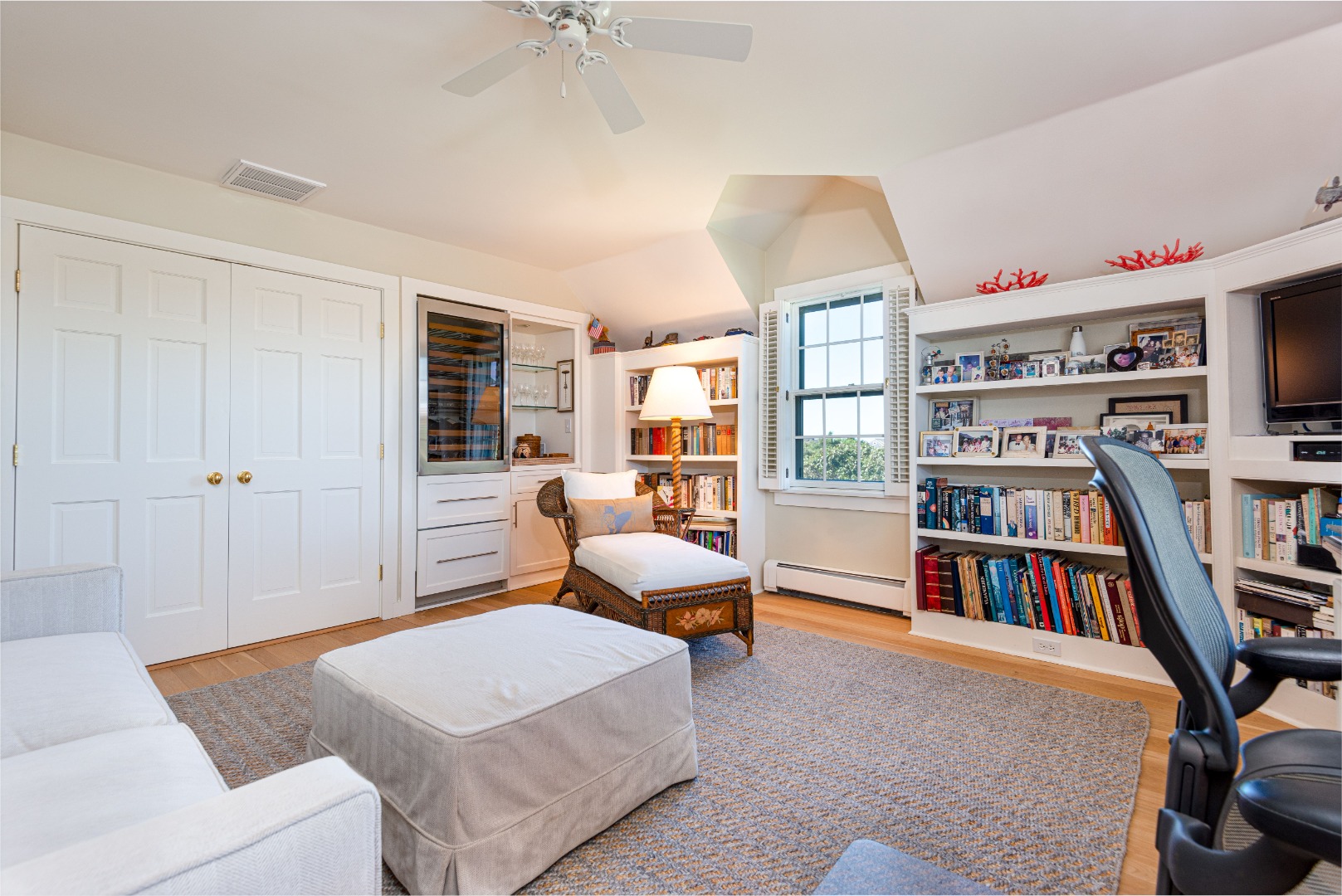 26 Pocomo Road Nantucket, MA 02554 - Photo 20 of 43 a living room with furniture and a book shelf