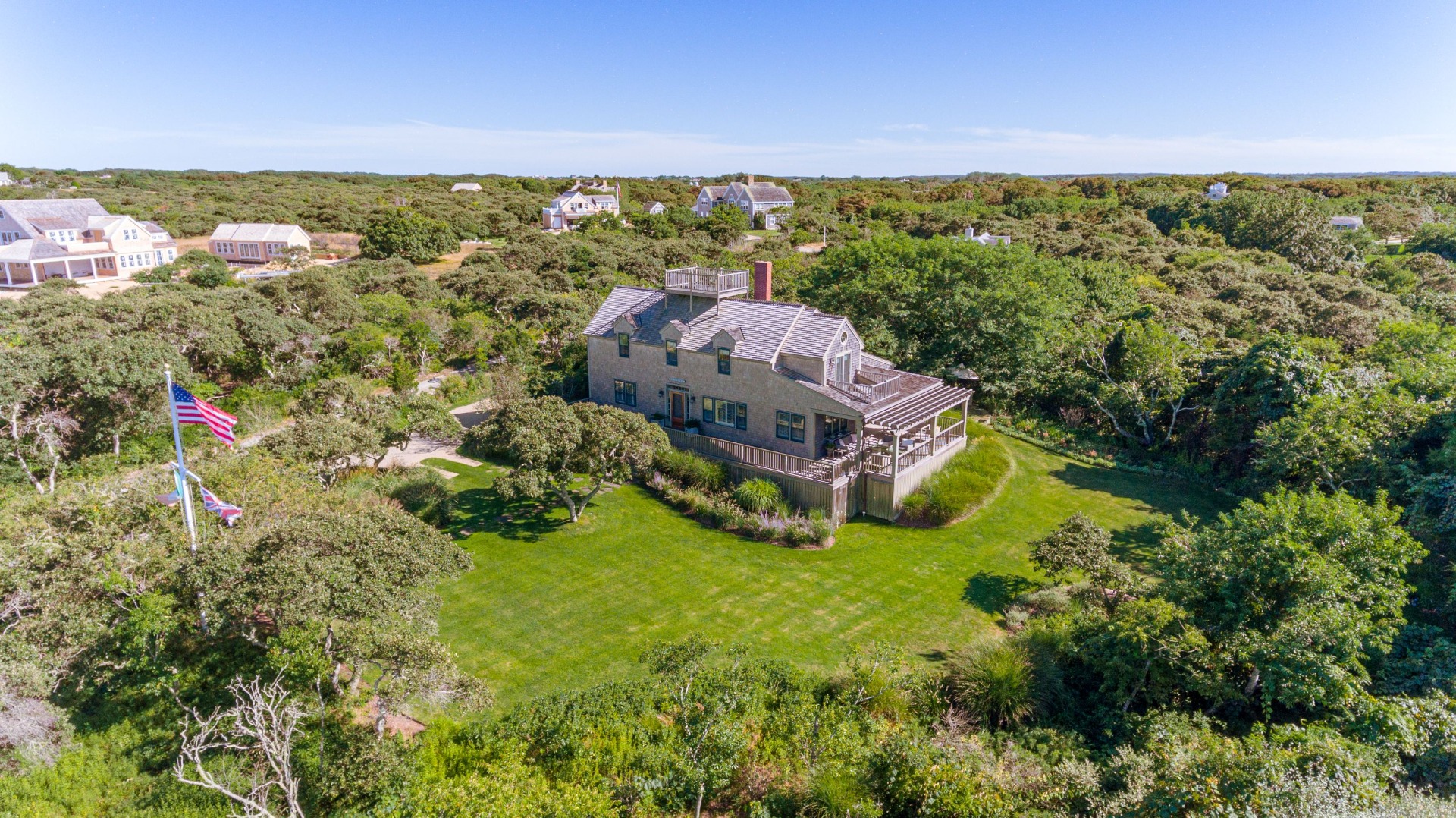 26 Pocomo Road Nantucket, MA 02554 - Photo 2 of 43 an aerial view of a house with a garden