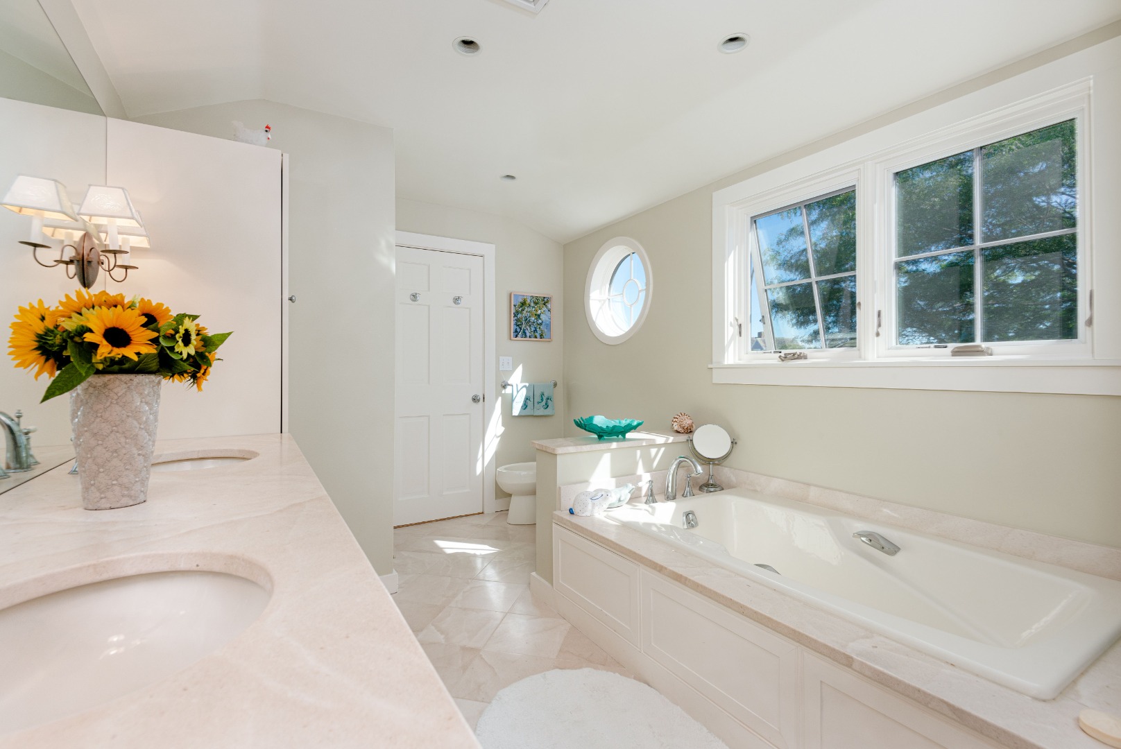 26 Pocomo Road Nantucket, MA 02554 - Photo 24 of 43 a bathroom with a tub sink and mirror