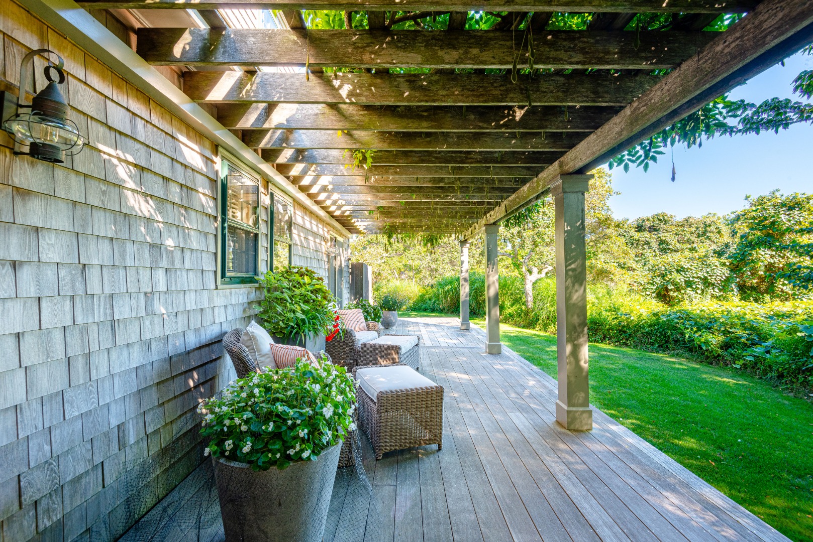 26 Pocomo Road Nantucket, MA 02554 - Photo 30 of 43 a garden view with a seating space