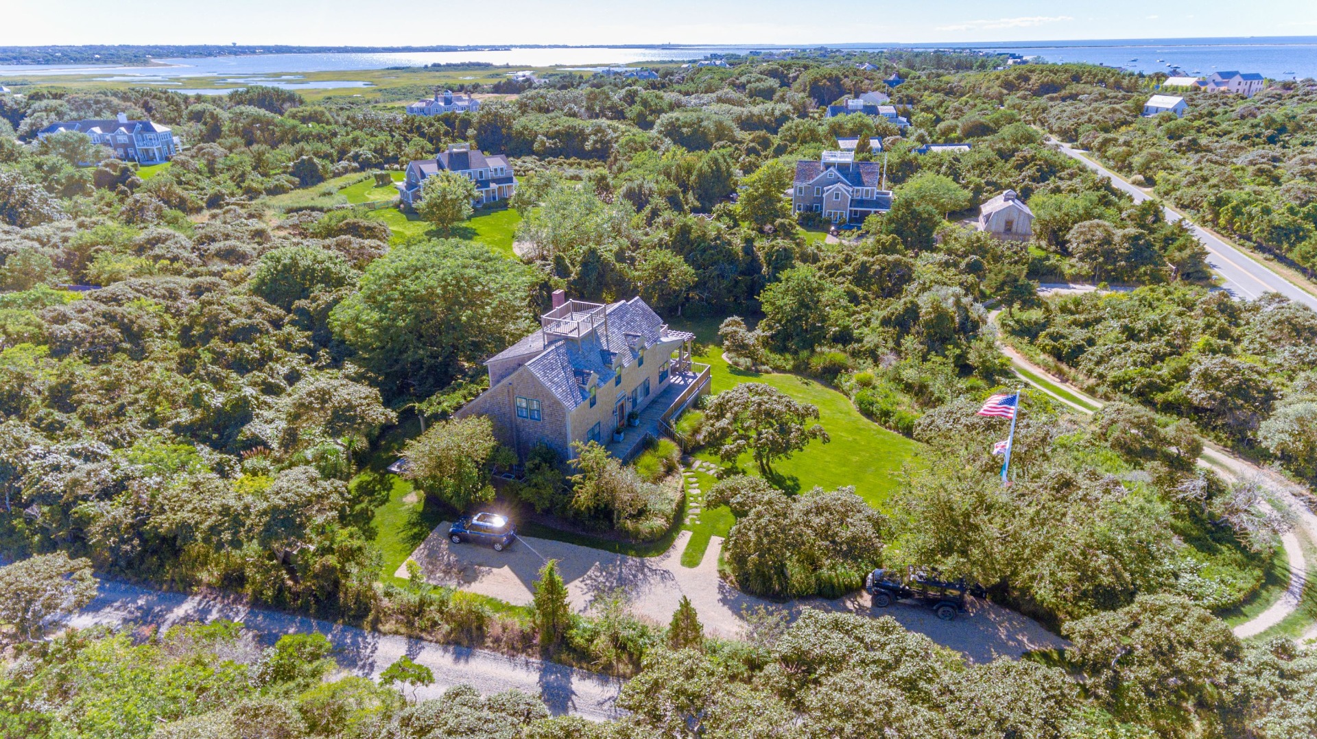 26 Pocomo Road Nantucket, MA 02554 - Photo 42 of 43 an aerial view of a house with a yard