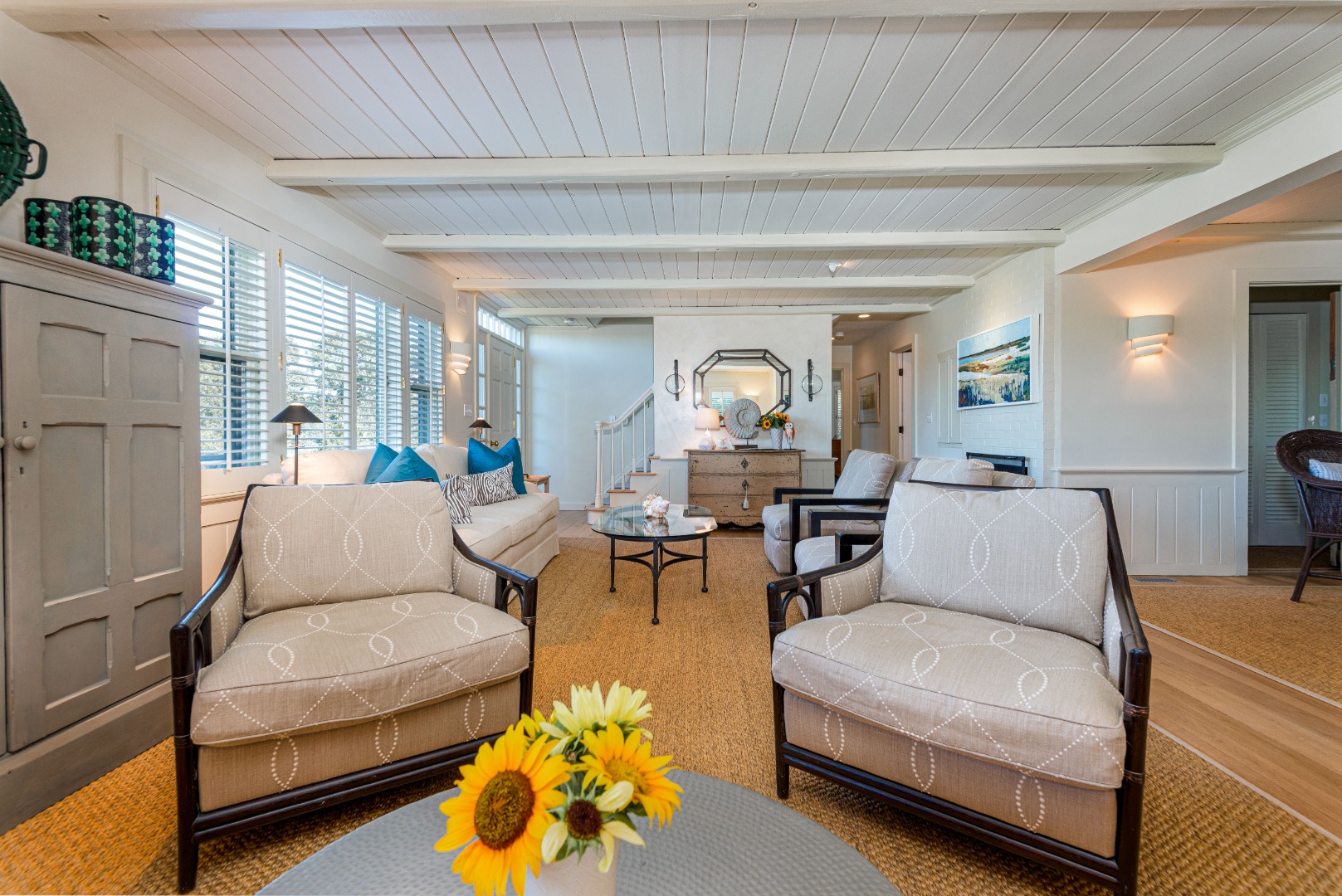 26 Pocomo Road Nantucket, MA 02554 - Photo 7 of 43 a living room with furniture and a chandelier