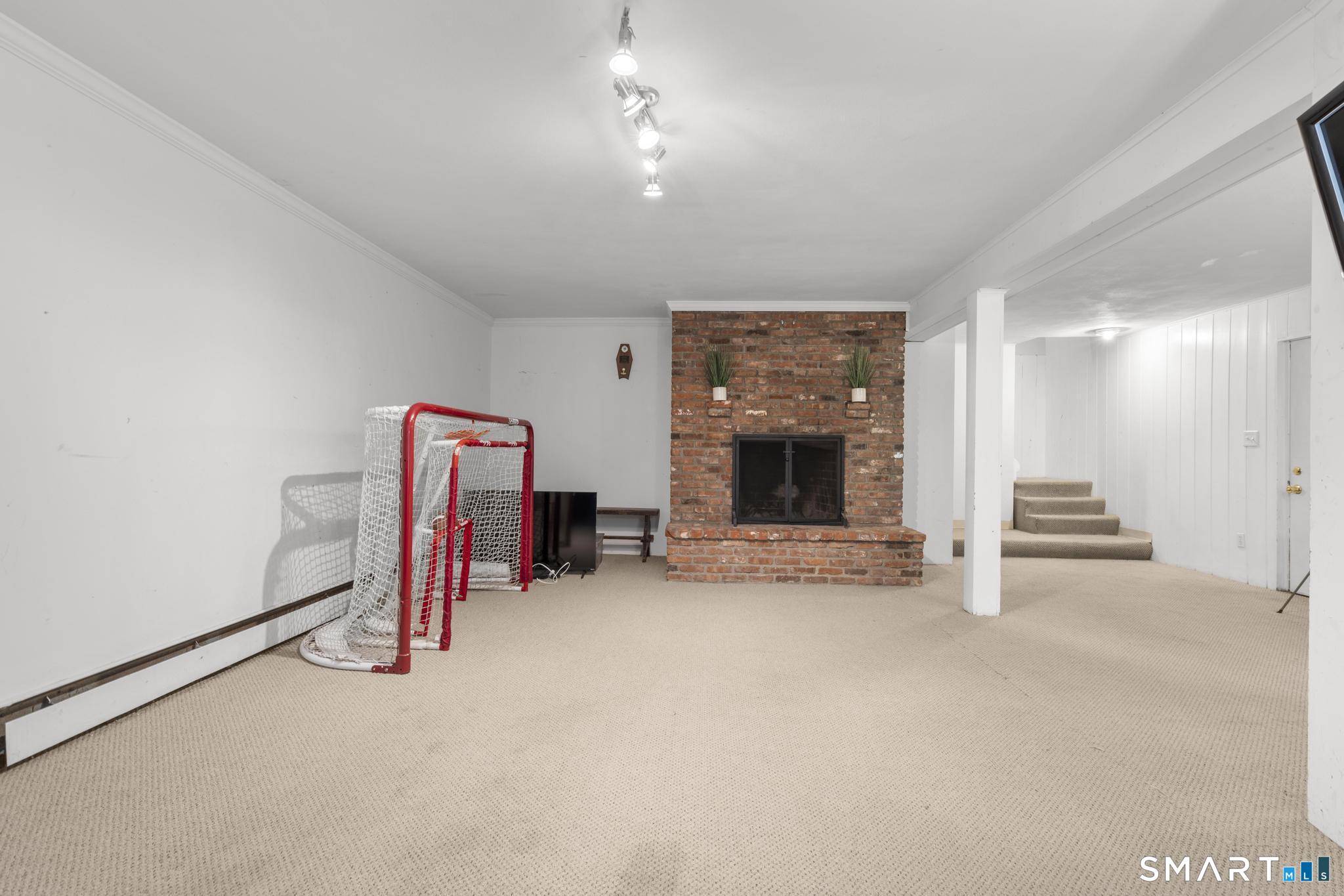 200 Old Huckleberry Road Wilton, CT 06897 - Photo 19 of 24 a view of a livingroom with a fireplace