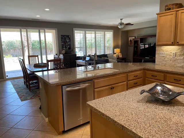 a kitchen with a sink and large window