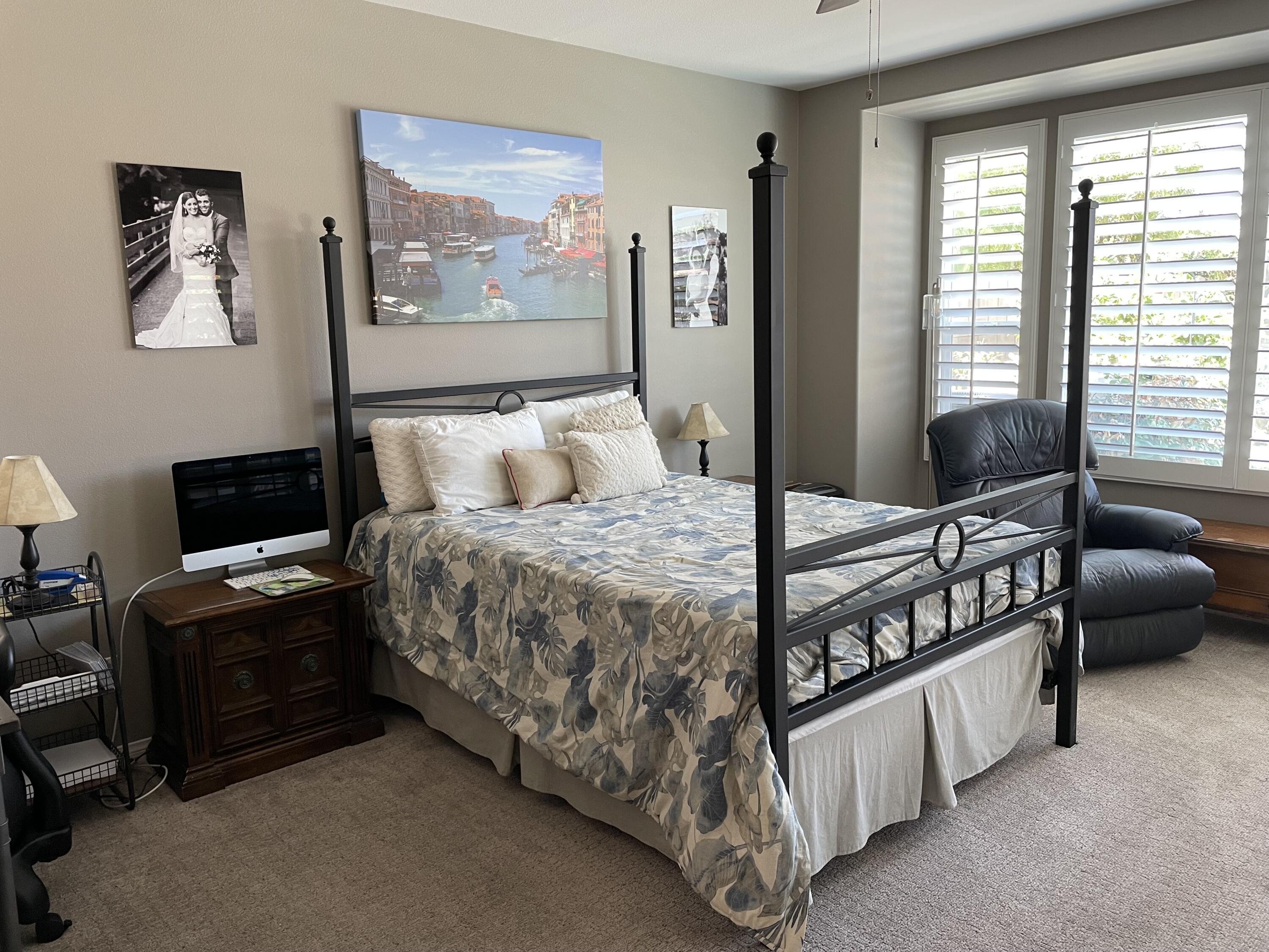 60880 Azul Court La Quinta, CA 92253 - Photo 13 of 33 a bedroom with a bed a couch and a window