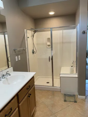 a bathroom with a bathtub shower sink and toilet