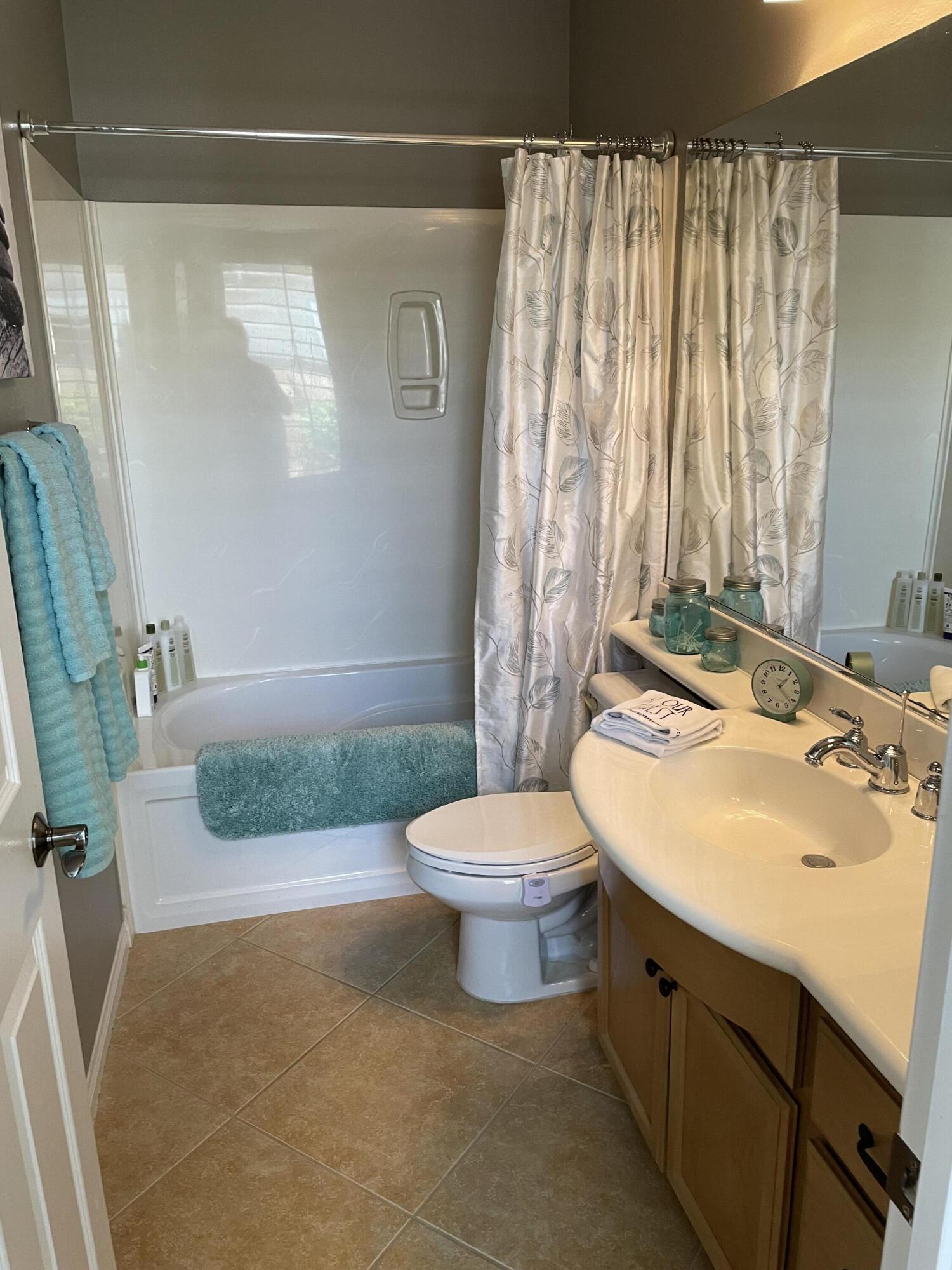 60880 Azul Court La Quinta, CA 92253 - Photo 23 of 33 a bathroom with a sink a toilet and tub