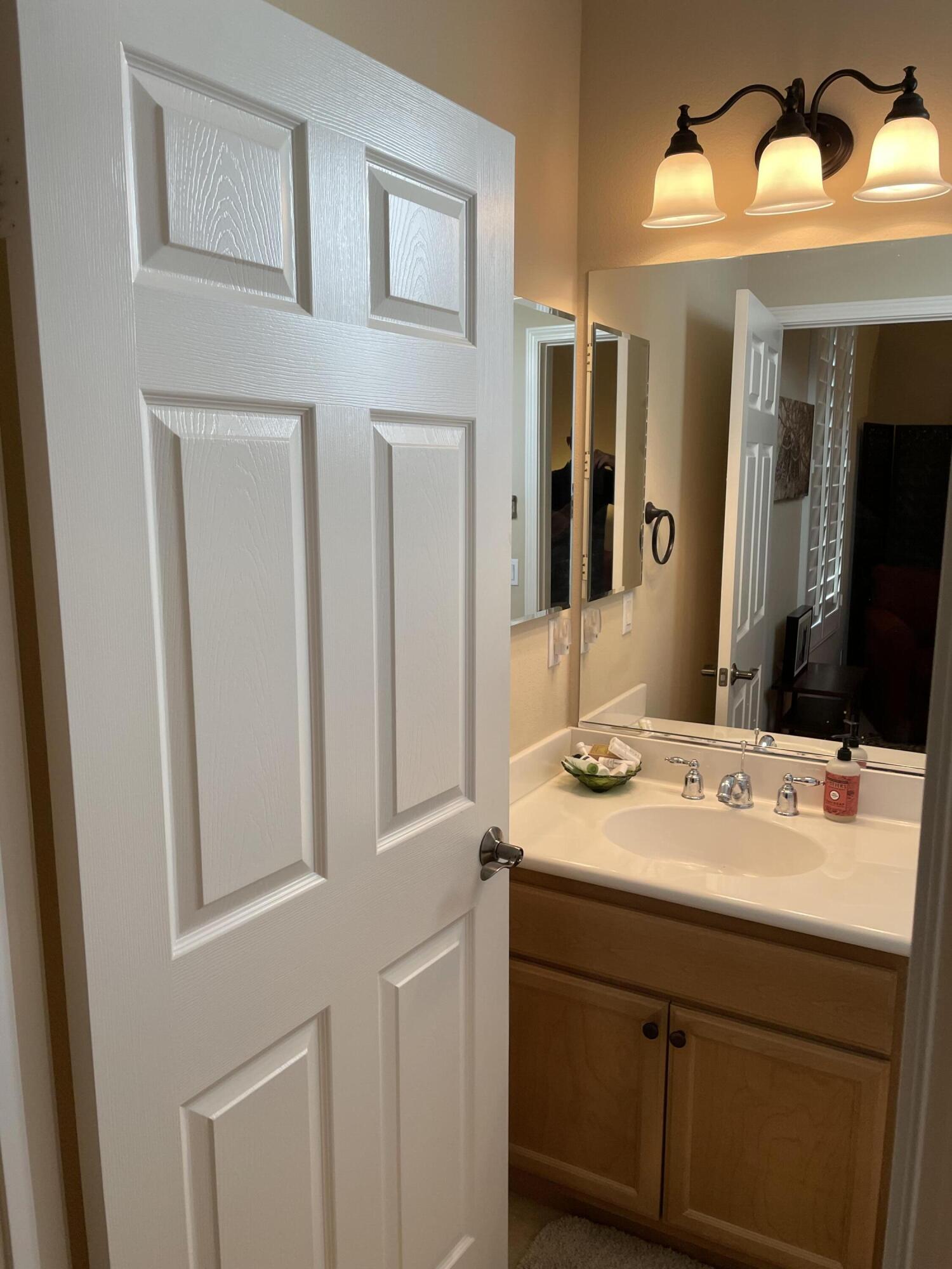 60880 Azul Court La Quinta, CA 92253 - Photo 26 of 33 a bathroom with a sink and a mirror