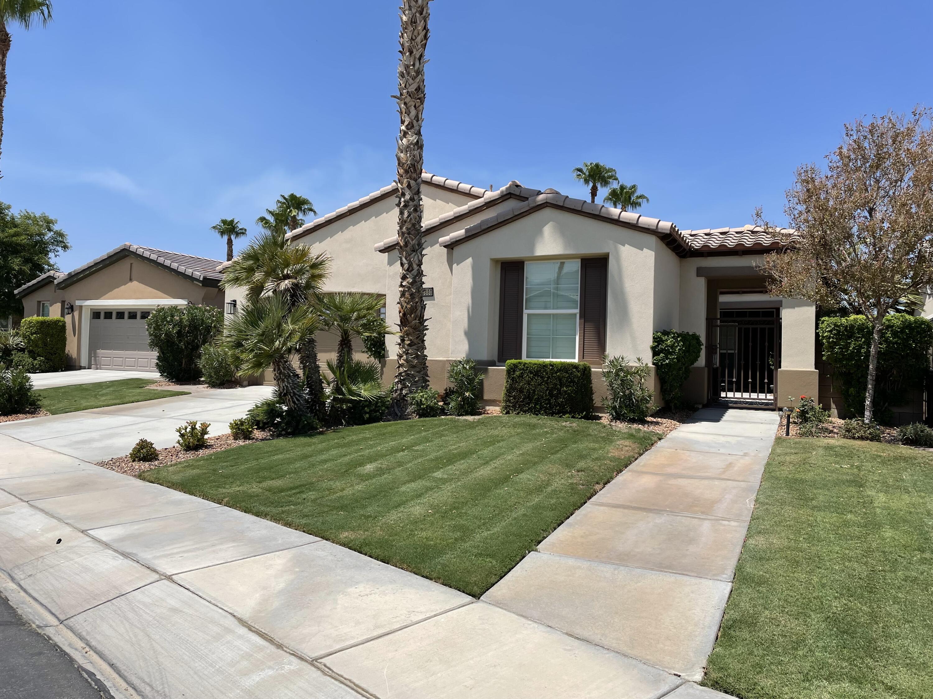 60880 Azul Court La Quinta, CA 92253 - Photo 28 of 33 a front view of a house with a yard