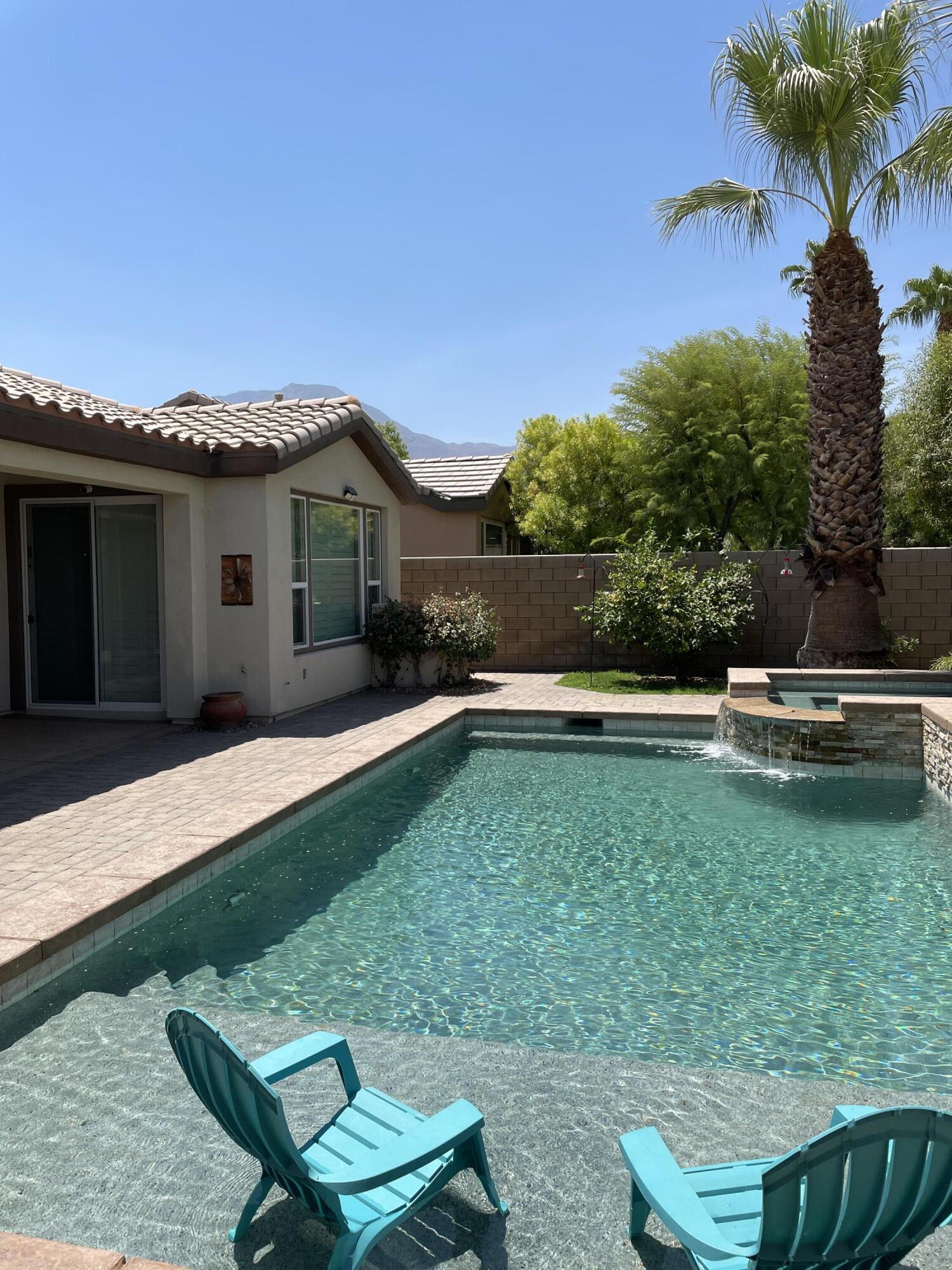 60880 Azul Court La Quinta, CA 92253 - Photo 3 of 33 a front view of a house with a yard