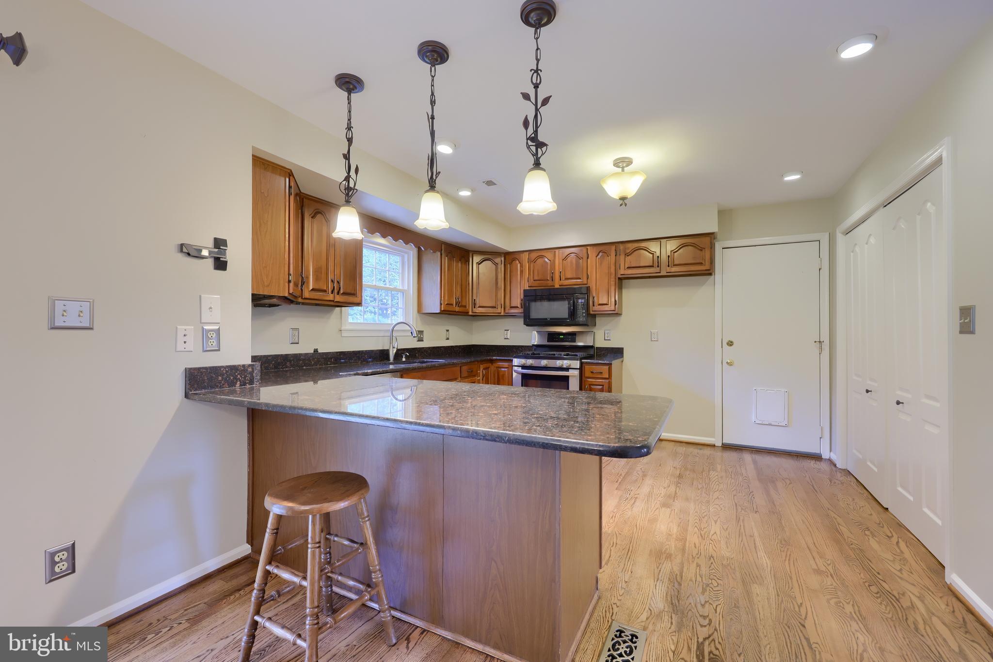 3645 Pleasant Valley Road York, PA 17406 - Photo 16 of 39 Kitchen w/ Granite Counters & Bar Seating