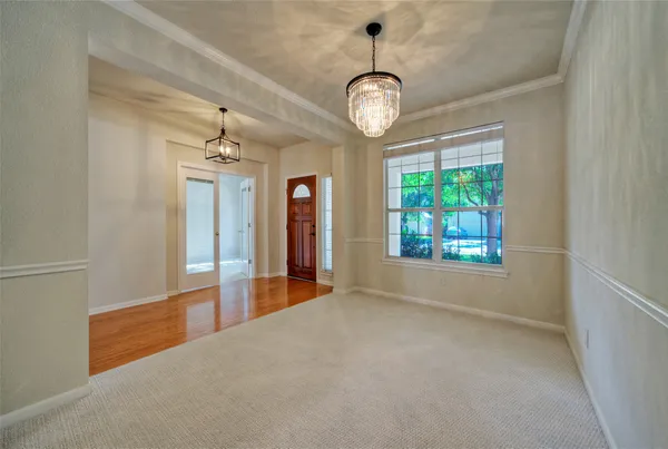 a view of a room with window and wooden floor