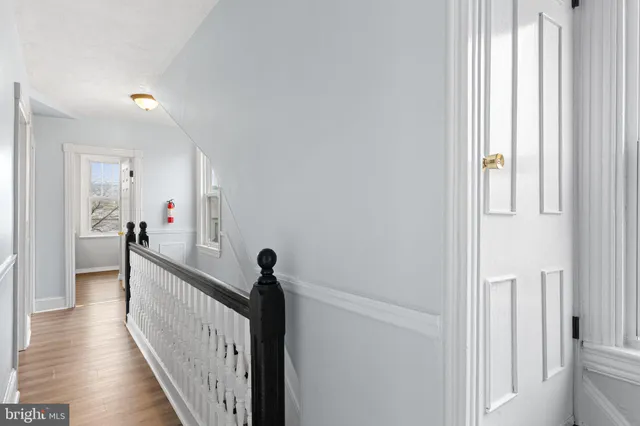 a view of a hallway with a hardwood floor