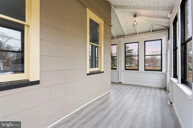 a view of front door of house with stairs