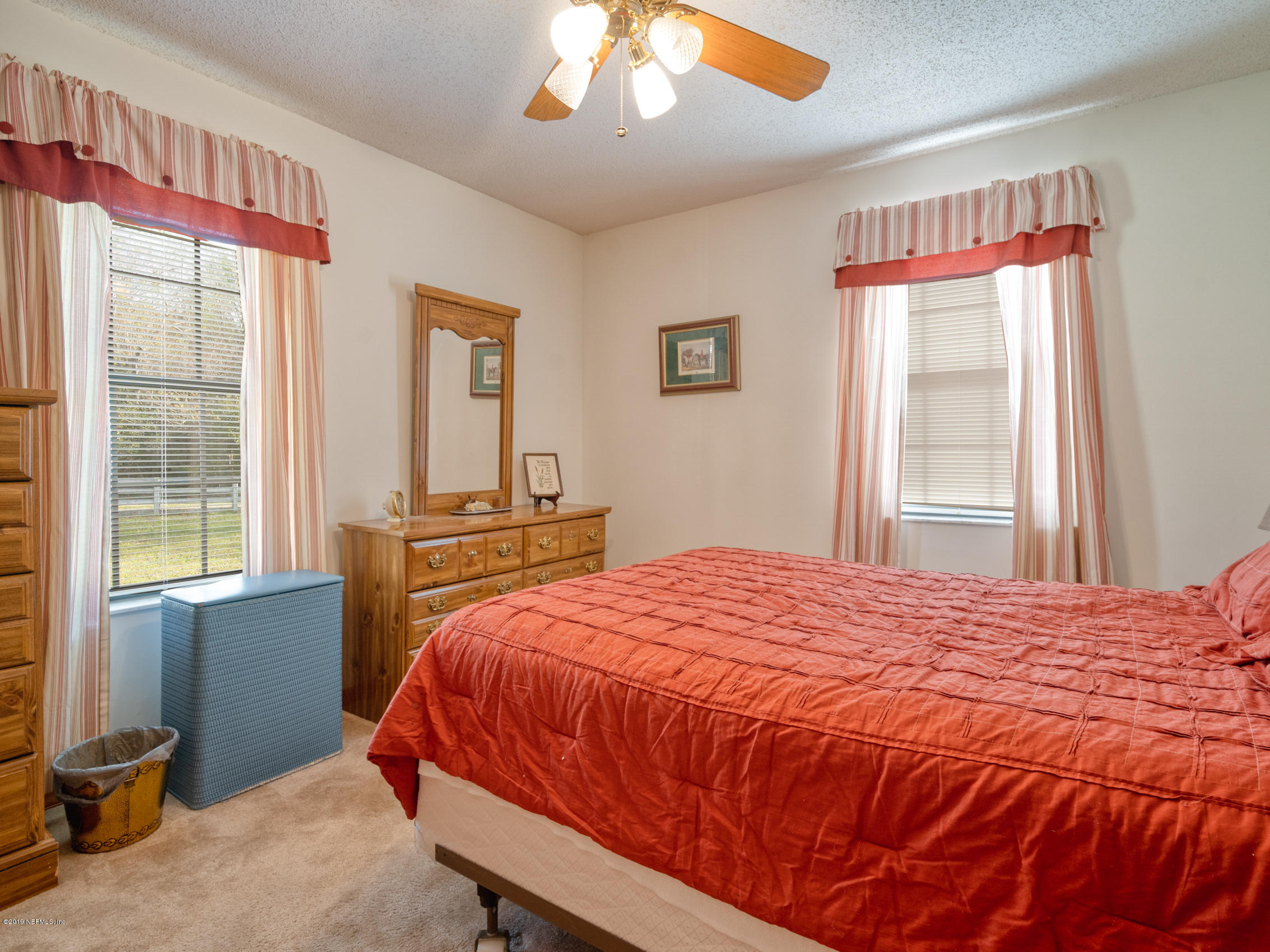 54814 Ogilvie Road Callahan, FL 32011 - Photo 16 of 30 a bedroom with a bed and a window