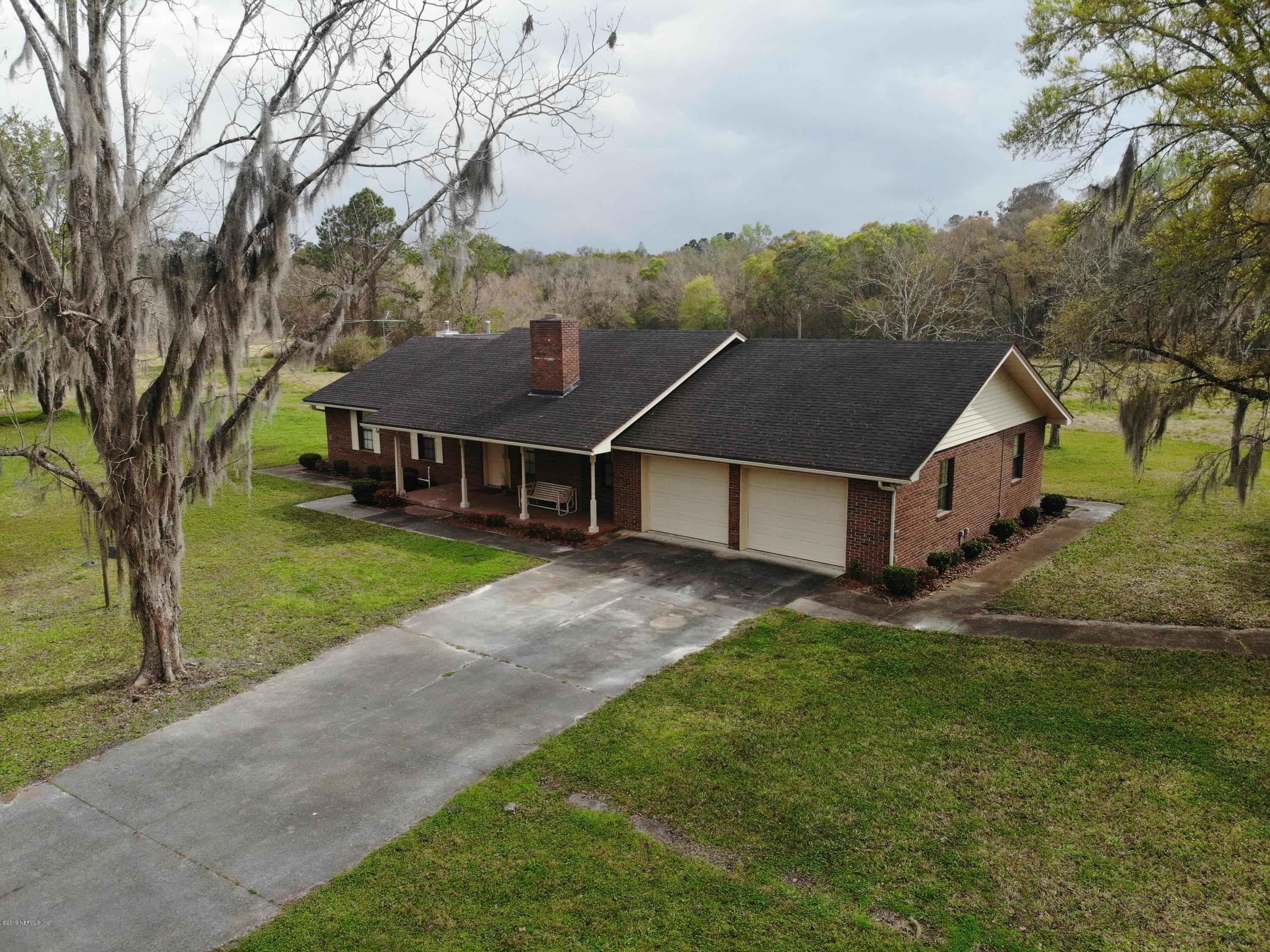 54814 Ogilvie Road Callahan, FL 32011 - Photo 30 of 30 a view of house with a big yard