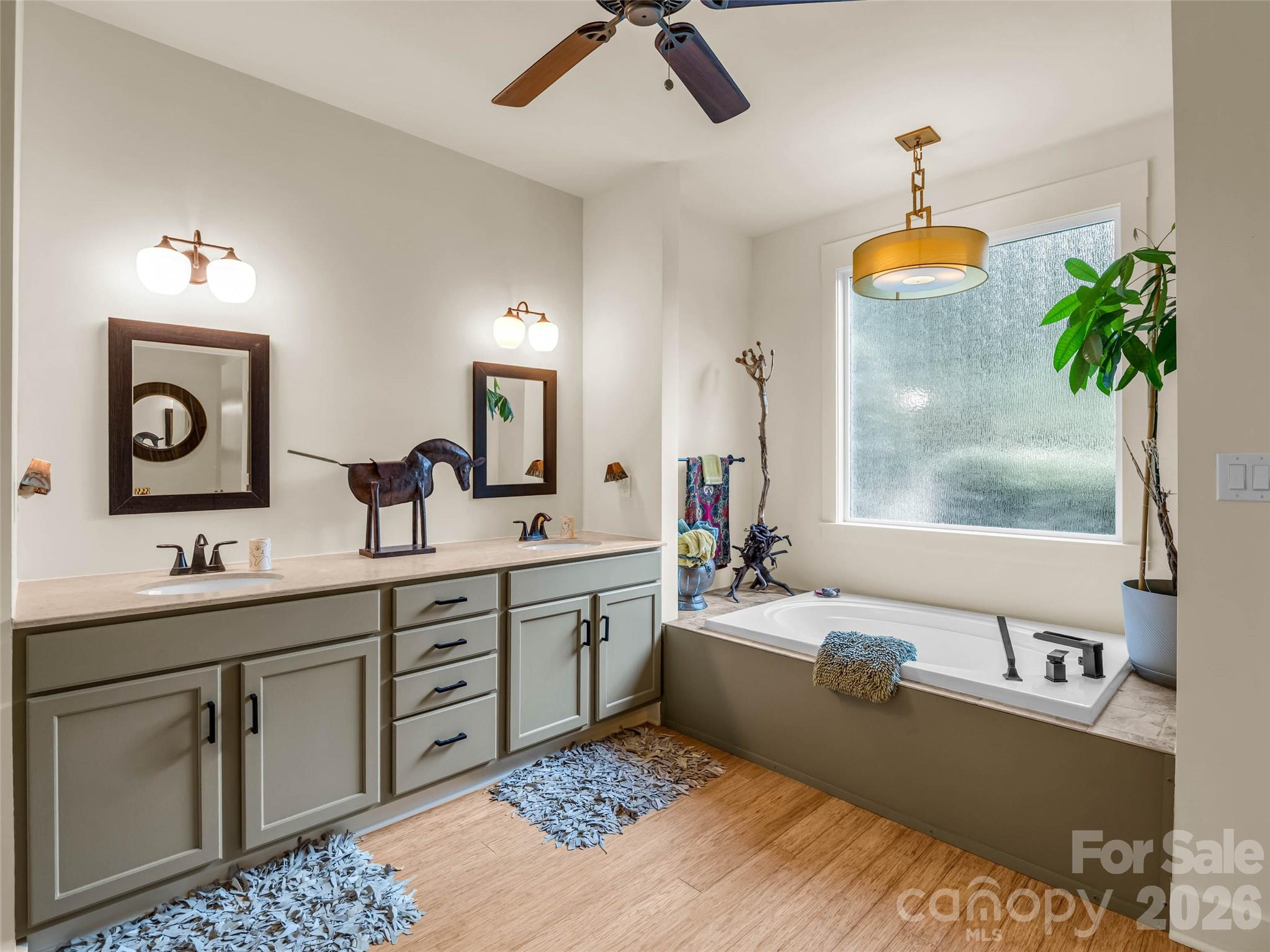 120 Glenn Court Mill Spring, NC 28756 - Photo 24 of 48 a spacious bathroom with a sink double vanity and a mirror