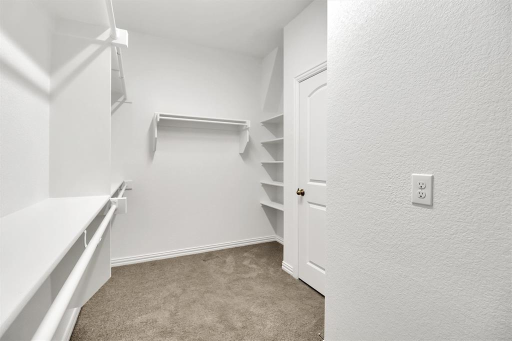 1022 Coppersmith Way Forney, TX 75126 - Photo 16 of 30 Walk-in closet with custom shelves