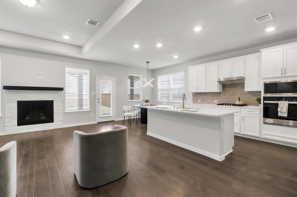 1022 Coppersmith Way Forney, TX 75126 - Photo 3 of 30 Living Room and Open Kitchen