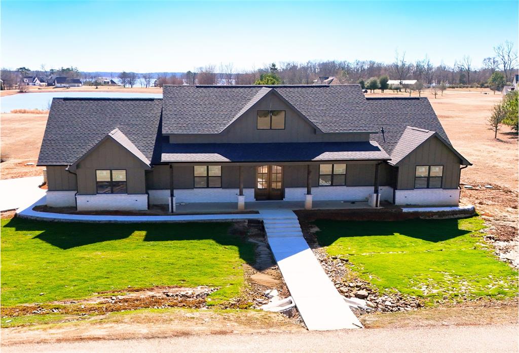 a view of a house with pool and chairs
