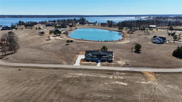 an aerial view of a house with outdoor space