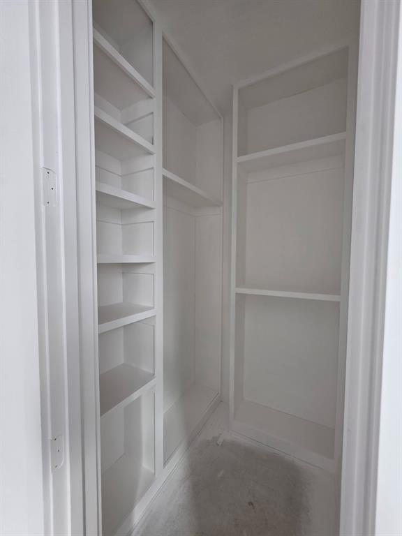 2712 Tbd Private Rd Mount Mount Pleasant, TX 75455 - Photo 6 of 15 a view of walk in closet with empty racks