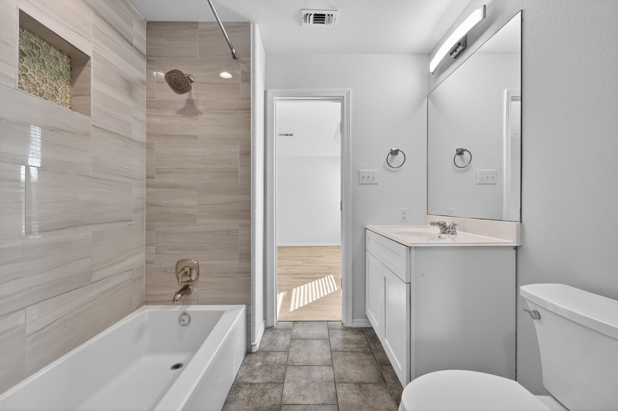 2305 Gavin Trail Pflugerville, TX 78660 - Photo 30 of 40 a bathroom with a bathtub shower sink mirror and toilet