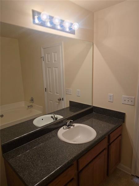 40 Middlebrook Drive Cartersville, GA 30120 - Photo 12 of 18 a bathroom with a sink and a mirror