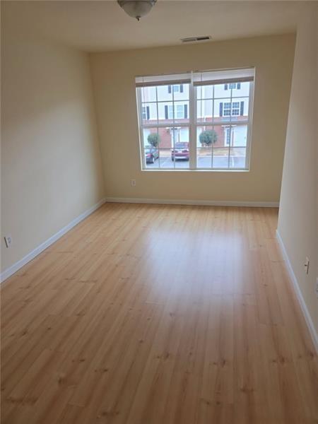 40 Middlebrook Drive Cartersville, GA 30120 - Photo 14 of 18 wooden floor in an empty room with a window