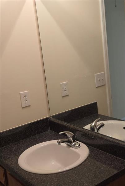 40 Middlebrook Drive Cartersville, GA 30120 - Photo 15 of 18 a bathroom with a sink and a mirror