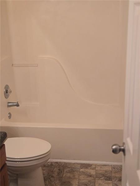 40 Middlebrook Drive Cartersville, GA 30120 - Photo 16 of 18 a bathroom with a toilet and a shower