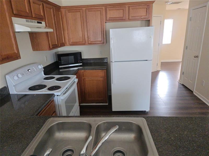 40 Middlebrook Drive Cartersville, GA 30120 - Photo 6 of 18 a kitchen with a refrigerator sink and stove