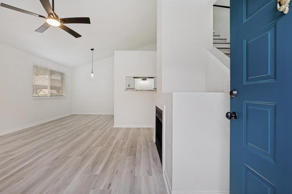 2240 Tarpley Road, Unit 92 Carrollton, TX 75006 - Photo 1 of 22 a view of empty room with wooden floor and fan
