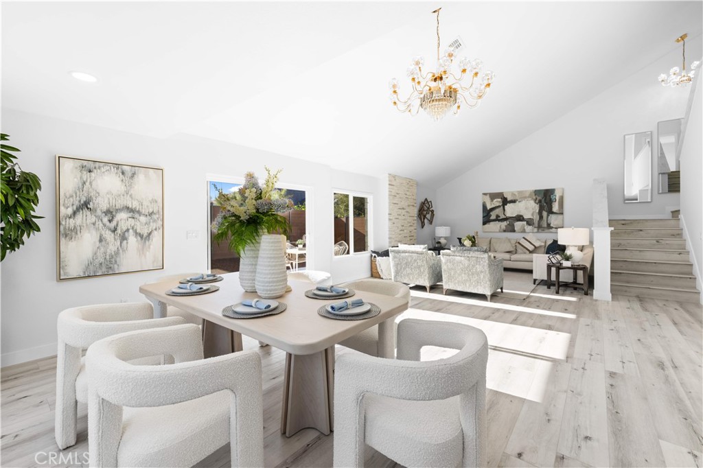 39 Cape Cod Irvine, CA 92620 - Photo 19 of 56 a dining room with furniture a large window and wooden floor