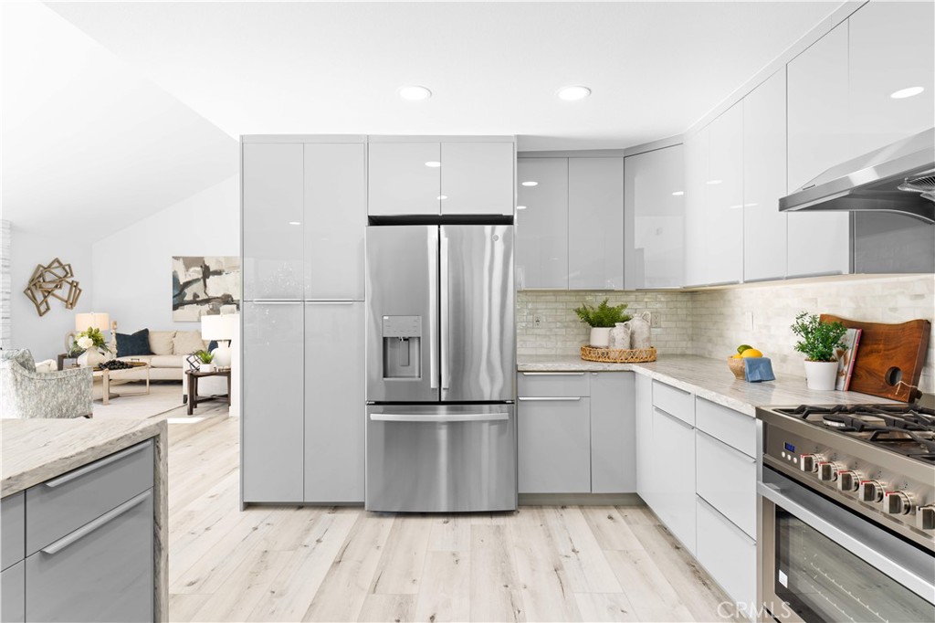 39 Cape Cod Irvine, CA 92620 - Photo 23 of 56 a kitchen with stainless steel appliances a refrigerator stove and sink