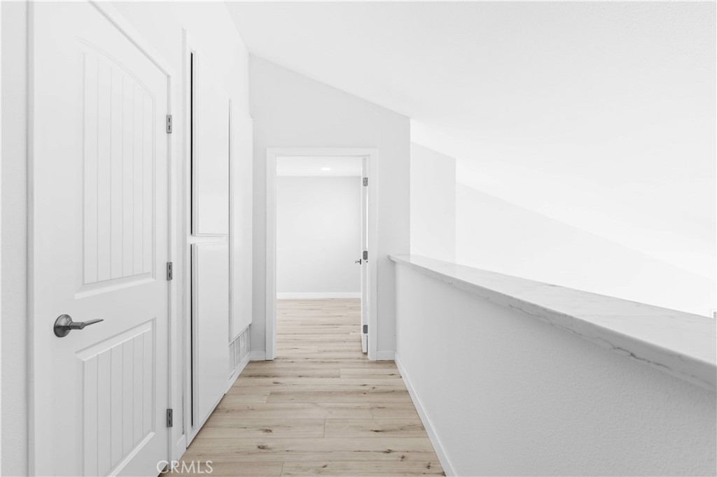 39 Cape Cod Irvine, CA 92620 - Photo 31 of 56 a view of a hallway with wooden floor