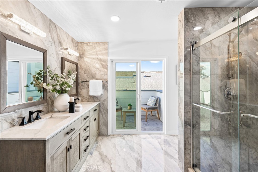39 Cape Cod Irvine, CA 92620 - Photo 38 of 56 a bathroom with a double vanity sink mirror and shower