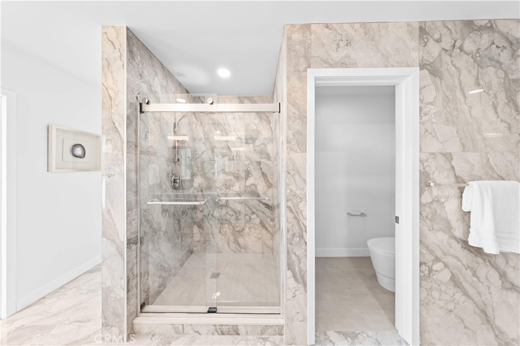 39 Cape Cod Irvine, CA 92620 - Photo 39 of 56 a bathroom with a shower and a toilet