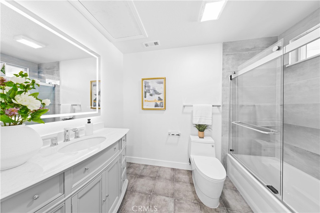 39 Cape Cod Irvine, CA 92620 - Photo 43 of 56 a bathroom with a sink a toilet and shower