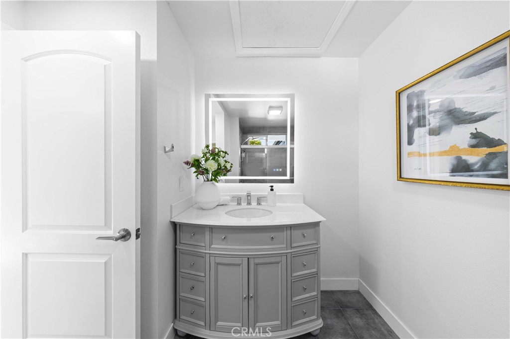 39 Cape Cod Irvine, CA 92620 - Photo 44 of 56 a bathroom with a sink and a mirror