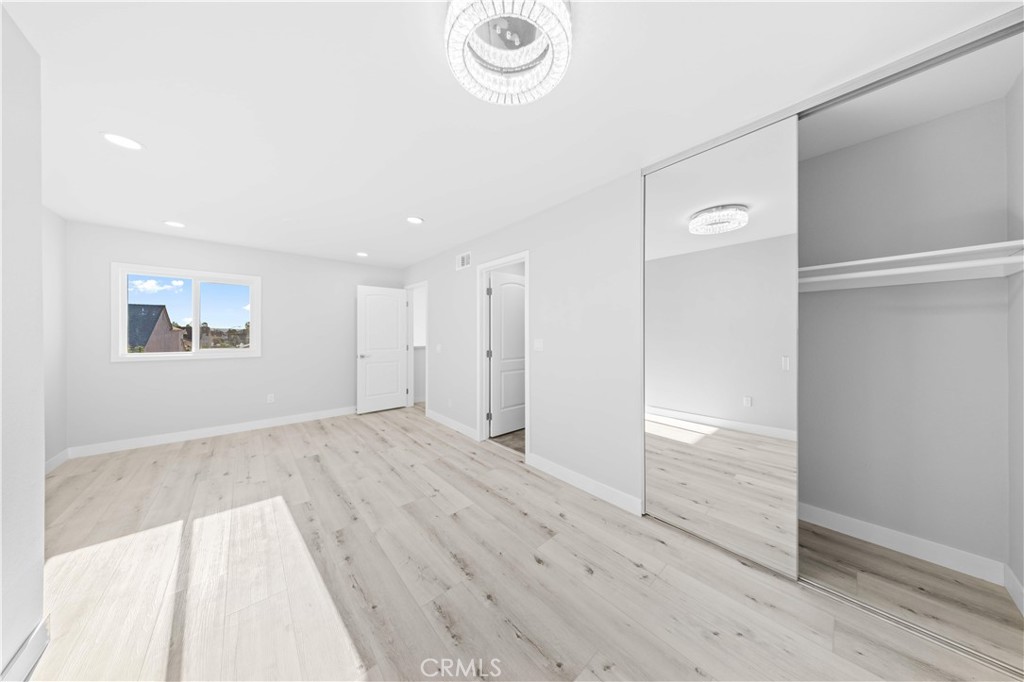 39 Cape Cod Irvine, CA 92620 - Photo 45 of 56 a view of an empty room with wooden floor and a window