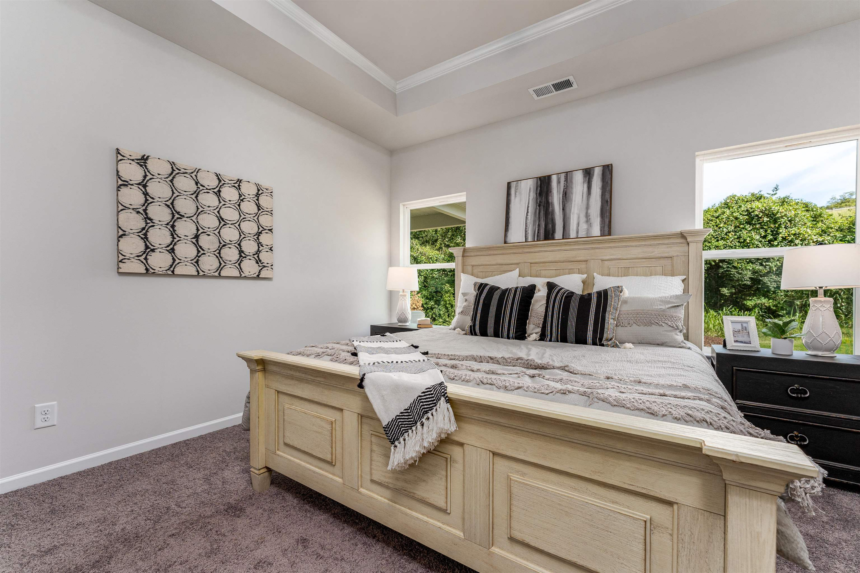 534 Troy Drive Sanford, NC 27332 - Photo 15 of 15 a bed sitting in a bedroom next to a window