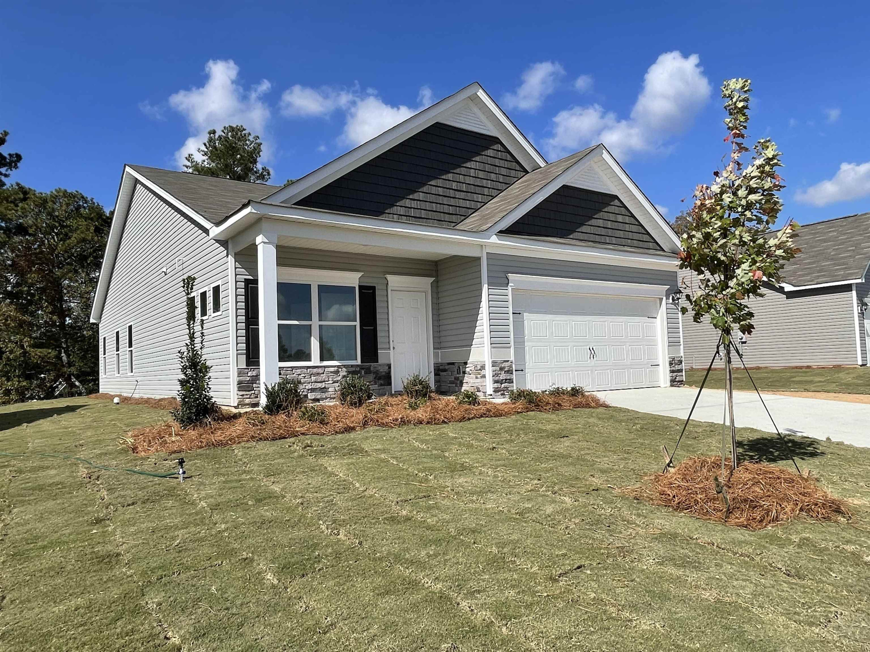 534 Troy Drive Sanford, NC 27332 - Photo 2 of 15 a backyard of a house with table and chairs