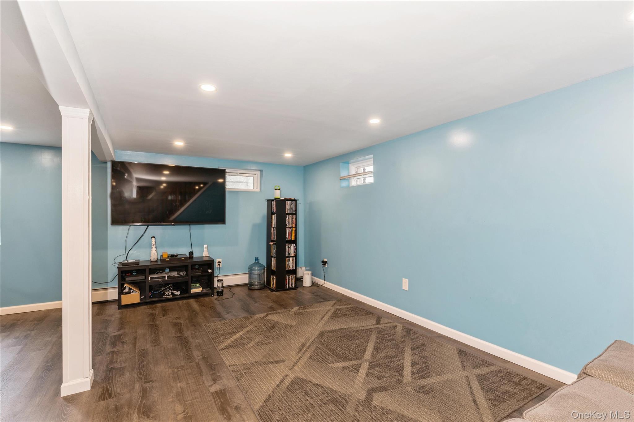 6 Jasper Street Valley Stream, NY 11580 - Photo 12 of 19 a view of a livingroom with furniture and a flat screen tv