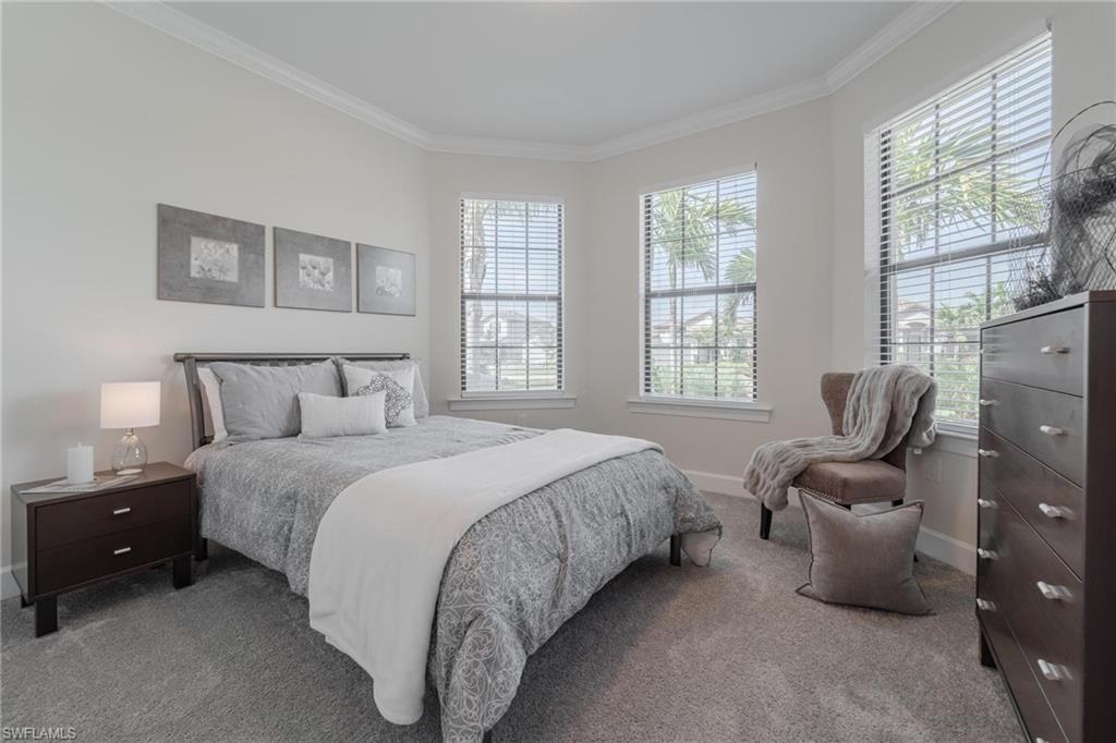 19855 Beverly Park Road Estero, FL 33928 - Photo 12 of 42 a bedroom with a bed and a couch