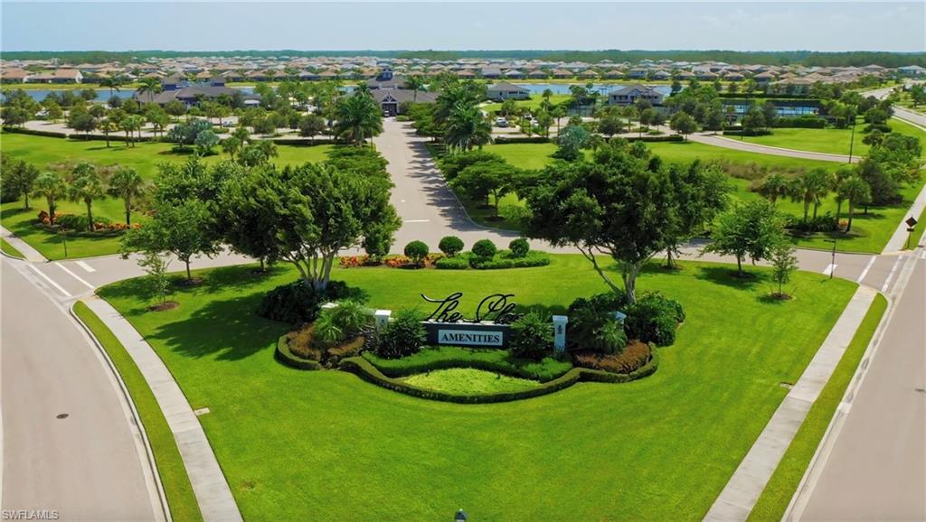 19855 Beverly Park Road Estero, FL 33928 - Photo 22 of 42 an aerial view of a golf course with chairs