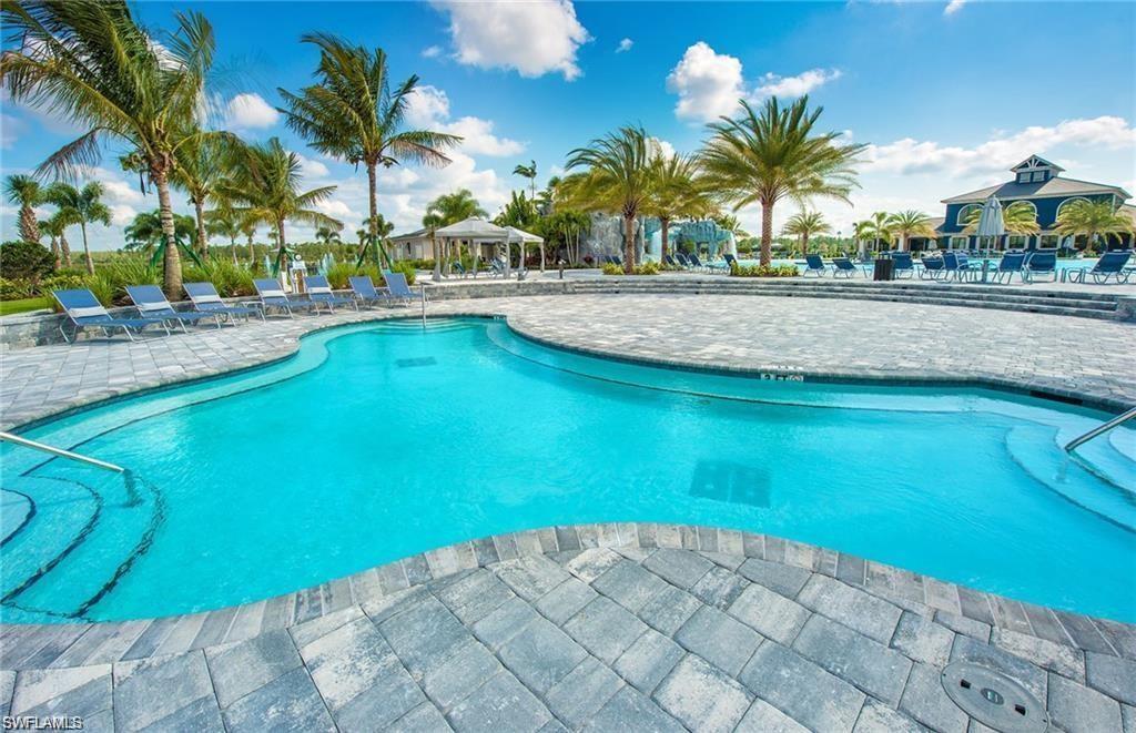 19855 Beverly Park Road Estero, FL 33928 - Photo 25 of 42 a view of a swimming pool and lounge chair