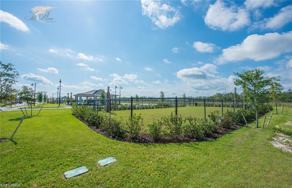 19855 Beverly Park Road Estero, FL 33928 - Photo 32 of 42 a view of a golf course with a lake